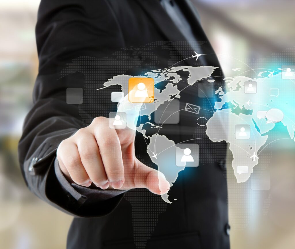 social network concept : business man point to social network and world map